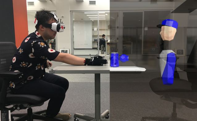 A person in a VR headset reaching for a cup, next to the virtual scene with a robot avatar