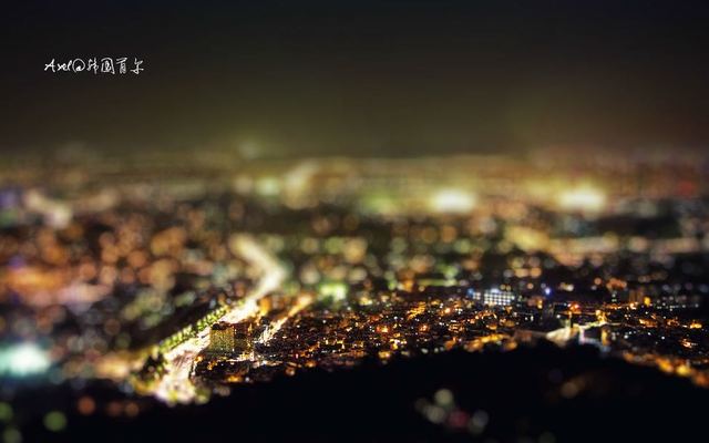 Photograph: a city at night seen from a mountain